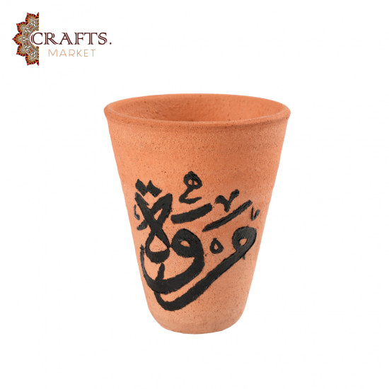 A hand-painted ceramic cup