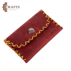 A handmade red leather snap wallet