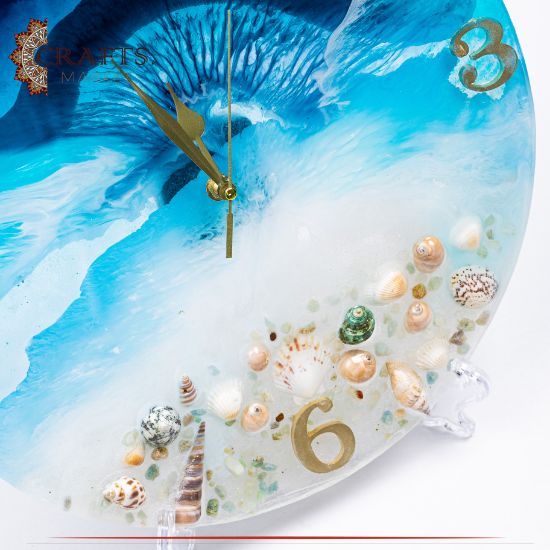 ساعة حائط دائرية من الراتينج مصنوعة يدويا بتصميم مستوحى من البحر