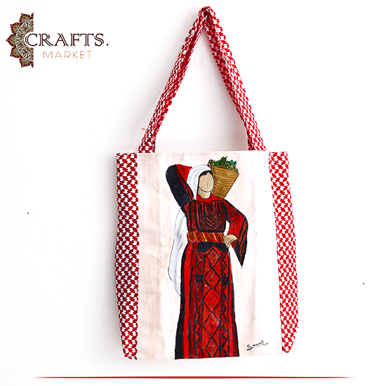 حقيبة نسائية من القماش مصنوعة يدوياً بتصميم إمرأة فلسطينية 