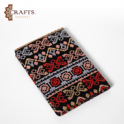 A notebook with a movable hand-embroidered cover