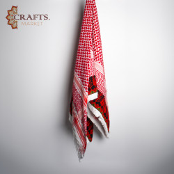 A red shemagh with red and green hand embroidery A red shemagh with red and green hand embroidery