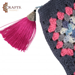 A handmade crochet clutch bag