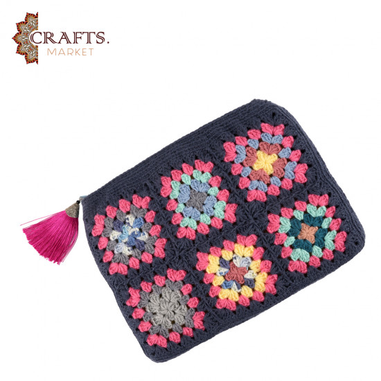 A handmade crochet clutch bag