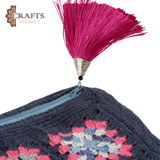 A handmade crochet clutch bag