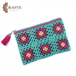 A handmade crochet clutch bag