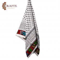 A hand-embroidered keffiyeh with the names of Palestinian cities