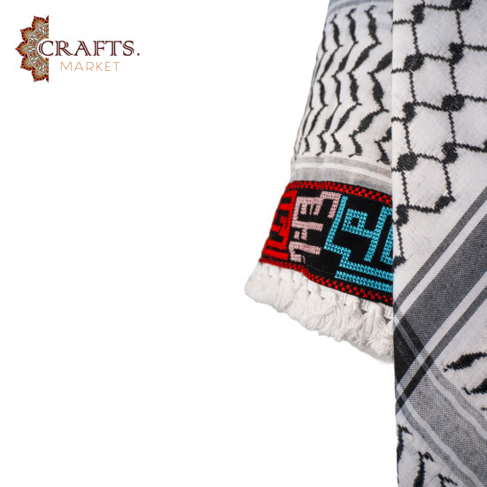 A hand-embroidered keffiyeh with the names of Palestinian cities