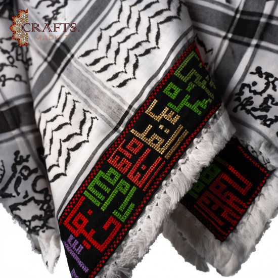 A hand-embroidered keffiyeh with the names of Palestinian cities