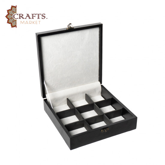 A handmade wooden gift box with a multicolored embroidered design A handmade wooden gift box with a multicolored embroidered design