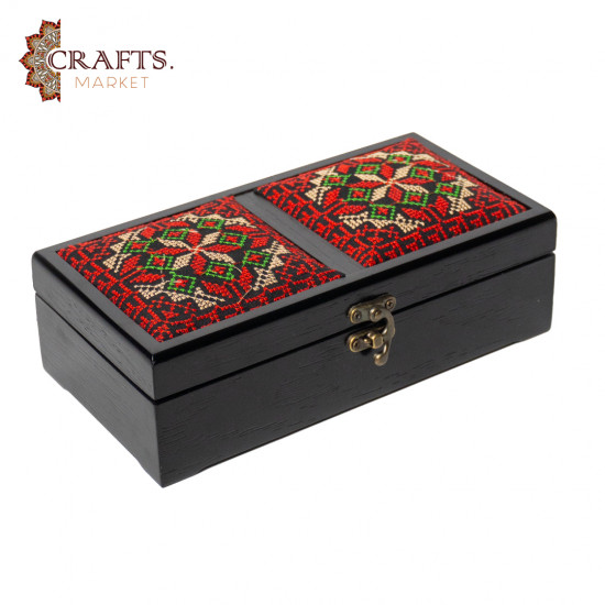 A handmade wooden gift box with a multicolored embroidered design A handmade wooden gift box with a multicolored embroidered design