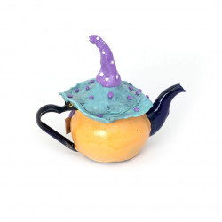 House shaped teapot table decor with purple hat
