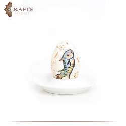 Hand-Carved Table Decor on a Goose Egg  with a "fish and black iris" design.
