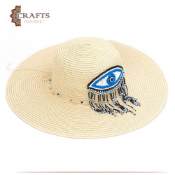 قبعة من القش مصنوعة يدوياً لون بيج بتصميم عين وشراشيب