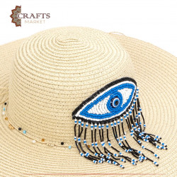 قبعة من القش مصنوعة يدوياً لون بيج بتصميم عين وشراشيب