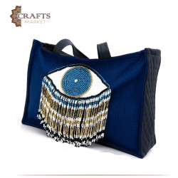 حقيبة من الكتان مصنوعة يدوياً لون كحلي بتصميم عين باللون الأزرق والأبيض