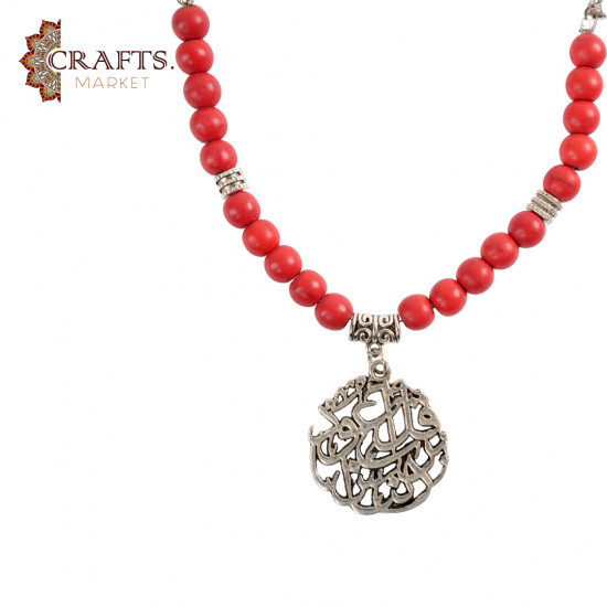 Red beaded necklace featuring a Quranic verse pattern Red beaded necklace featuring a Quranic verse pattern