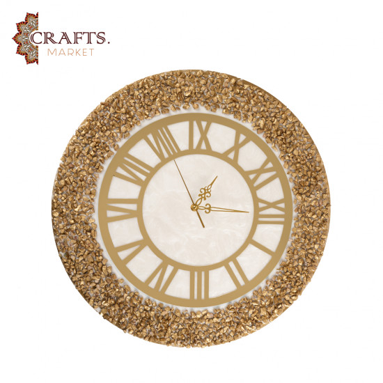 A handmade wall clock made of epoxy in gold and pearly white colors