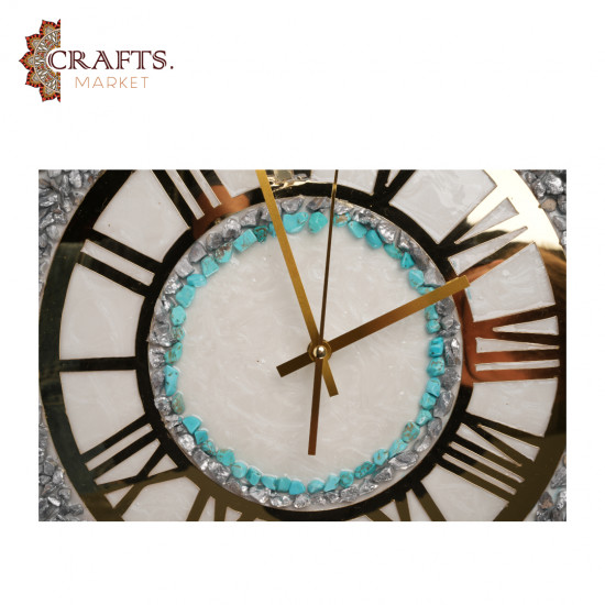 A handmade wall clock made of epoxy in gold and pearly white colors