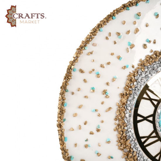 A handmade wall clock made of epoxy in gold and pearly white colors
