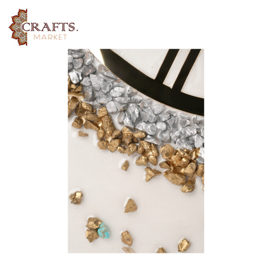 A handmade wall clock made of epoxy in gold and pearly white colors