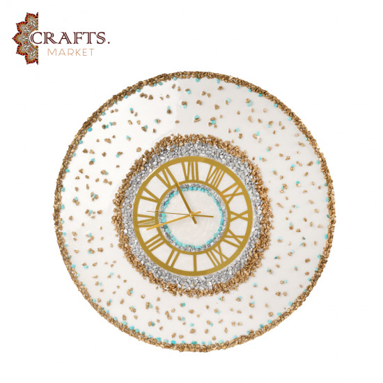 A handmade wall clock made of epoxy in gold and pearly white colors