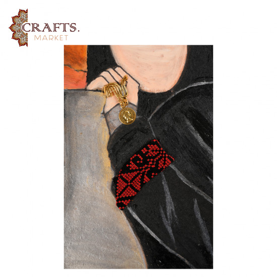 A hand-painted wall hanging featuring a woman in traditional Jordanian attire