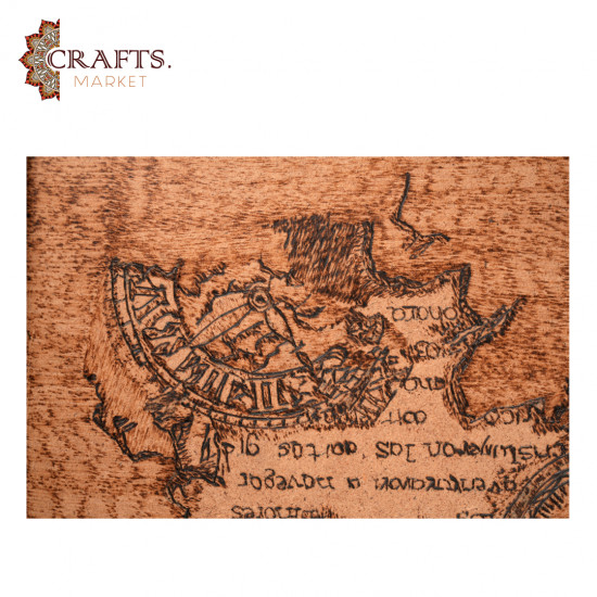 A hand-painted wall hanging featuring a compass design