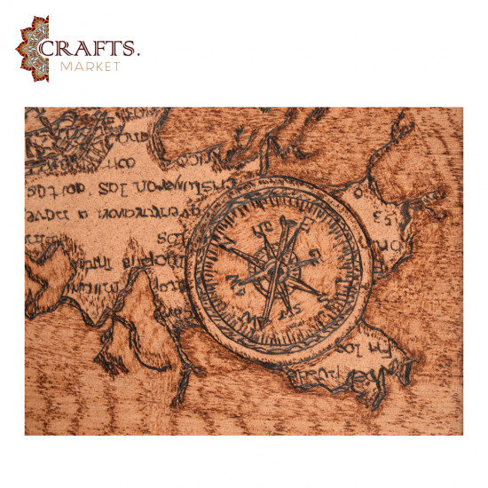 A hand-painted wall hanging featuring a compass design