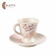 Handmade ceramic clay coffee cup with saucer featuring Arabic calligraphy