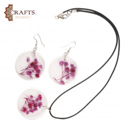 A handmade set of natural-flower resin jewelry earrings and a necklace in dark purple