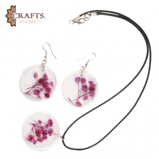 A handmade set of natural-flower resin jewelry earrings and a necklace in dark purple