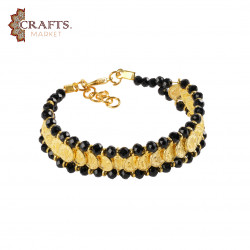 A handmade bracelet made of metal and beads,Gold and Black