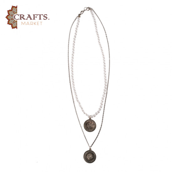 A handmade necklace made of metal, beads, and pearls