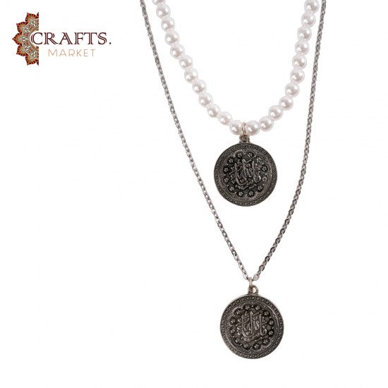 A handmade necklace made of metal, beads, and pearls